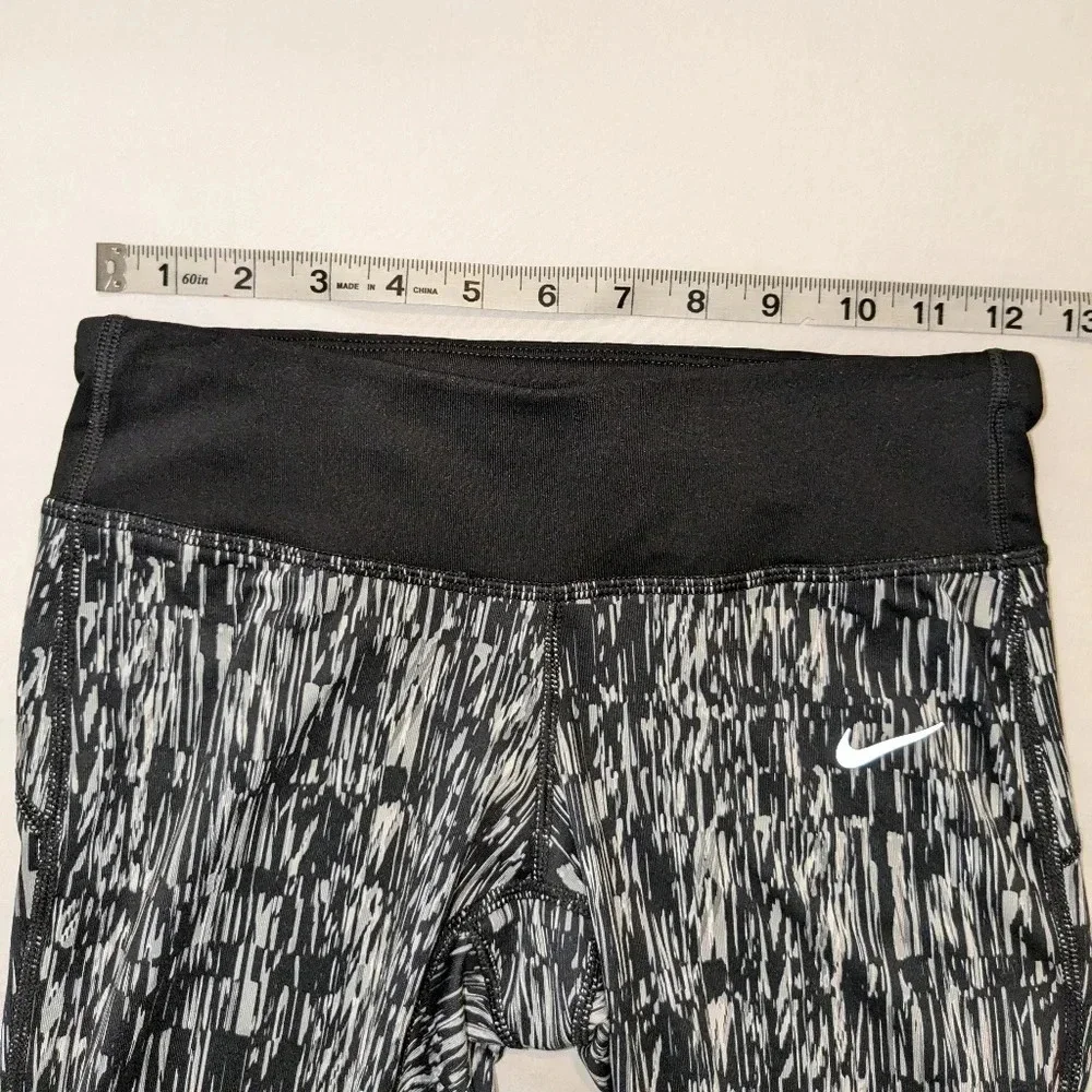 Nike women's graphic DRI-FIT tight running Capri leggings, size XS , black/white